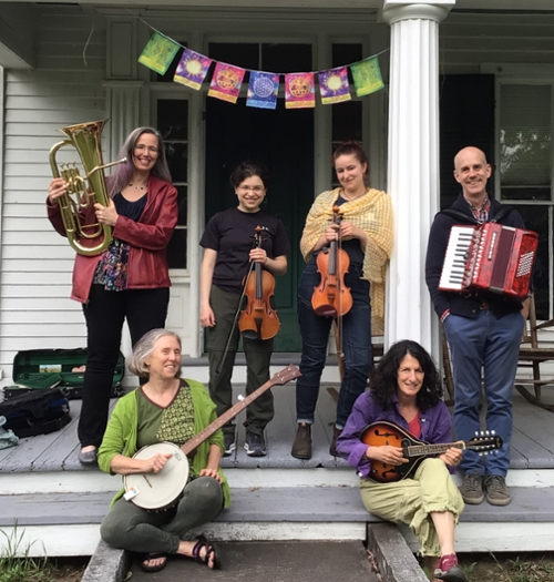 6 people playing music on front porch