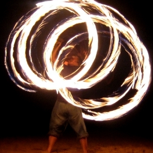 firespinner - fire twirler with staff - upload by haloeffect, wikipedia